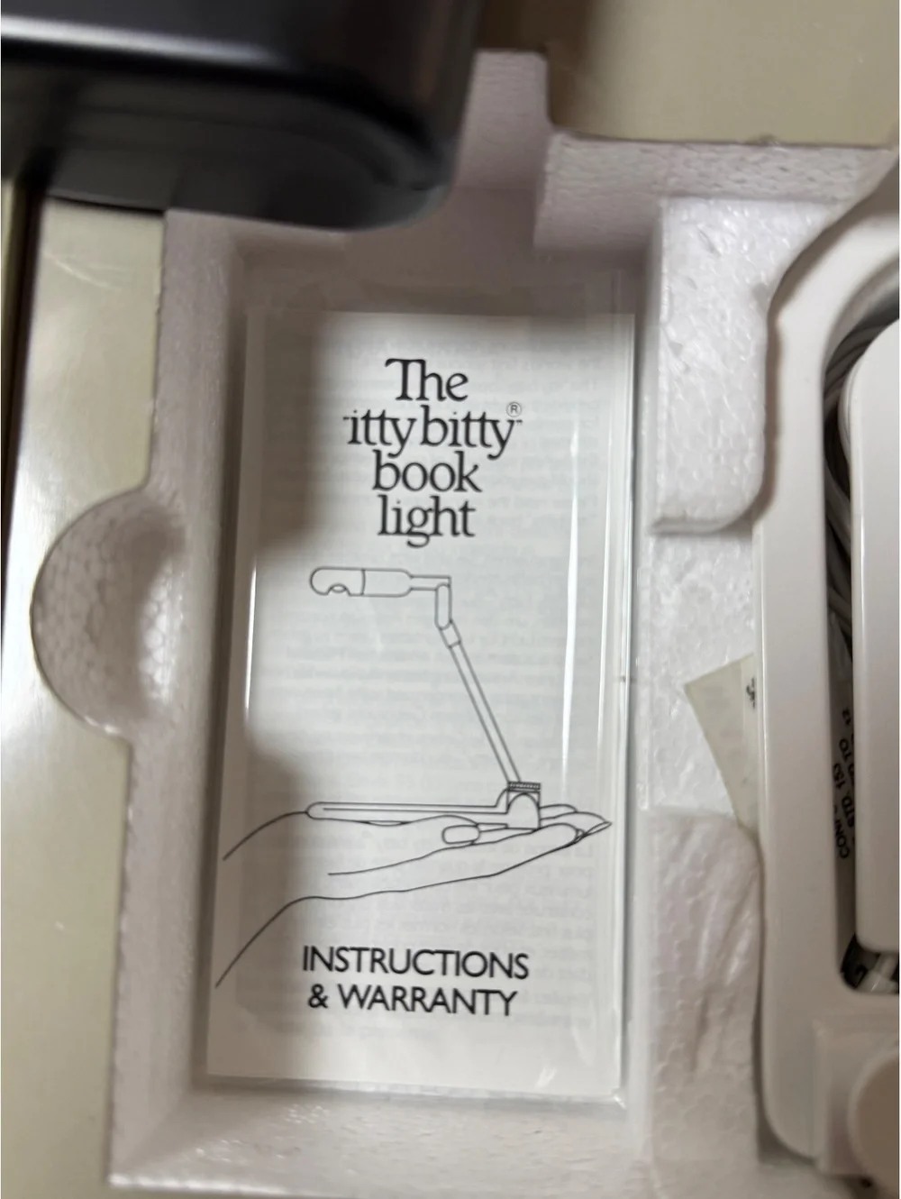 The itty bitty book light by Zalco - Vintage Reading Light 1982